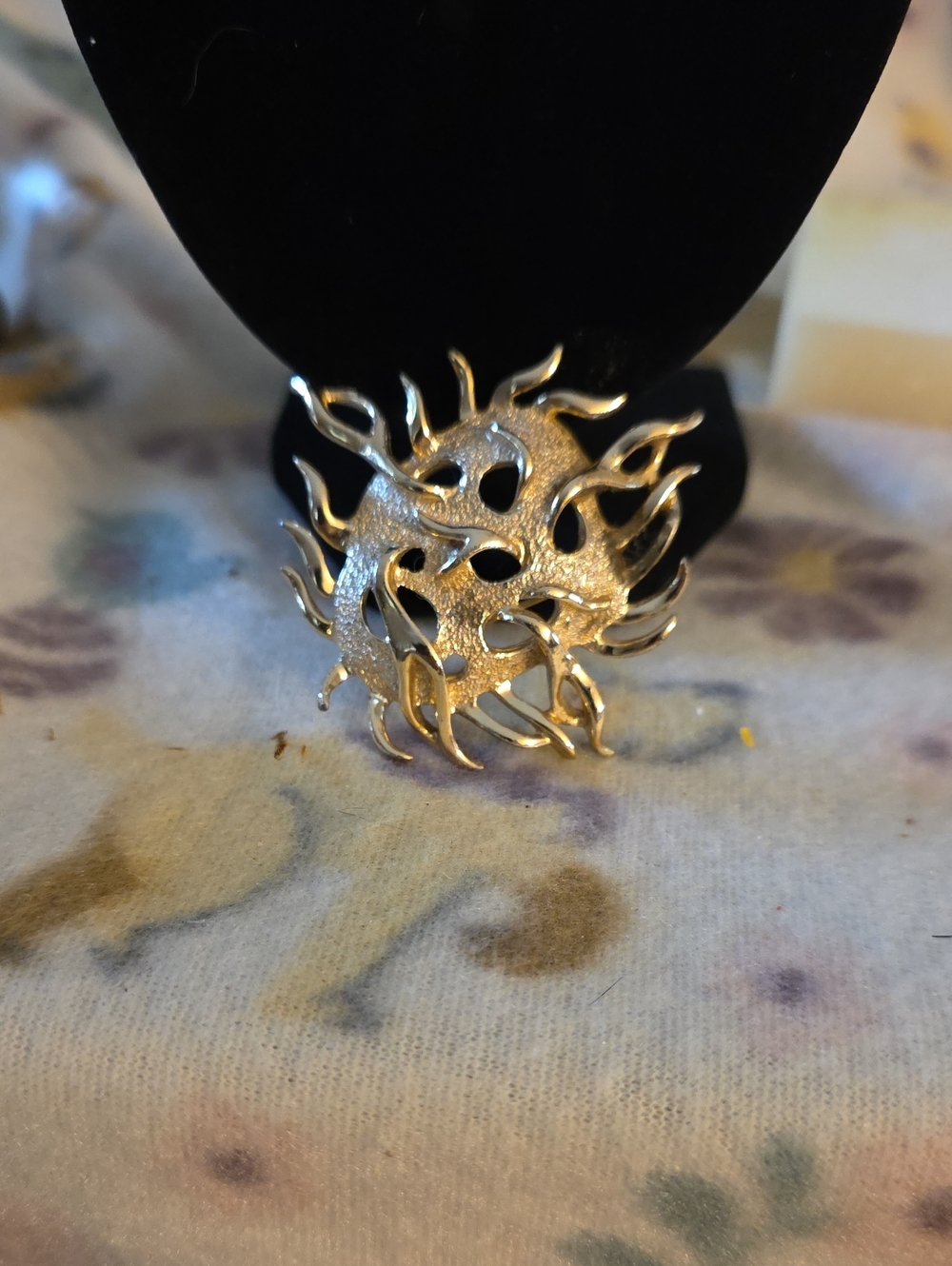 vintage Sarah Coventry gold-tone sea urchin brooch featuring a textured finish